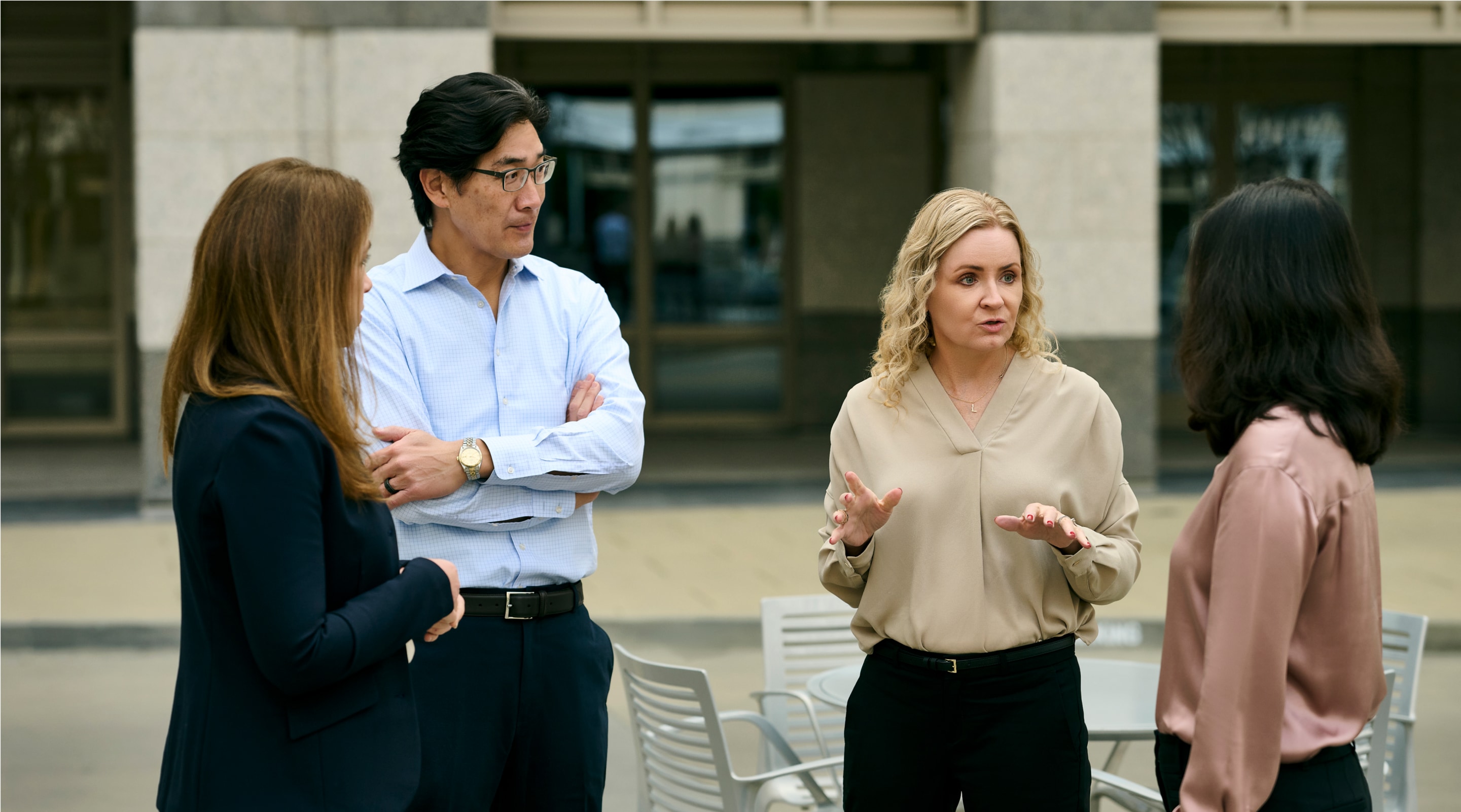 Group of HGGC team outside talking